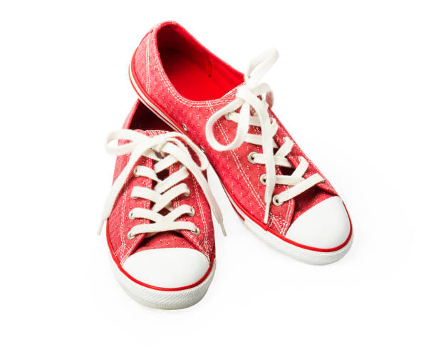 istock Red sneakers on a white background. Youth shoes 1331506730