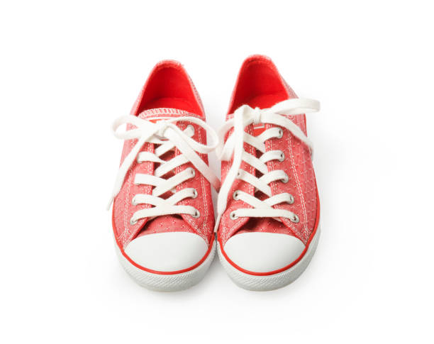istock Red sneakers on a white background. Youth shoes 1331506897