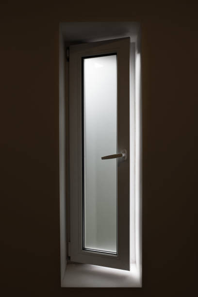 istock Bathroom window with frosted glass, light shining though but can not see though, privacy concept. 1331507789