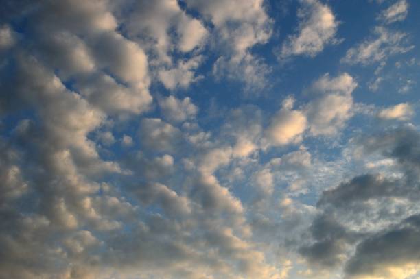 istock Cirdle gray-white clouds in the rays of sunset . 1331507796