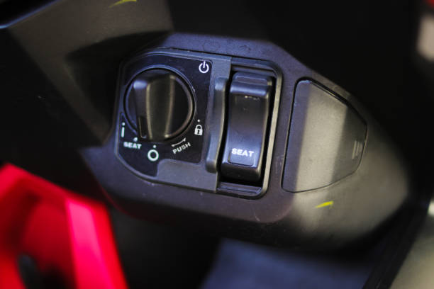 istock Motorcycle ignition to illustrating security. Close-up view of motorcycle key ignition switch starter. 1331509595