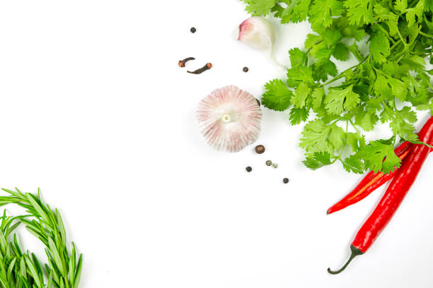 Garlic, parsley and red pepper on white background.