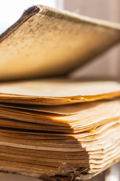istock Old weathered book with empty pages. Education concept. History concept. Aged open book. Wisdom and knowledge concept. Vintage hardcover of book. School background. Retro literature. 1331510473