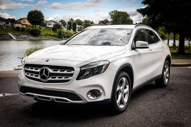 Mercedes Benz GLA 250 2019 white car outdoor shot at summer Sorel-Tracy, Canada - July 30, 2021: Mercedes Benz GLA 250 2019 white car outdoor shot at summer mercedes benz photos stock pictures, royalty-free photos & images