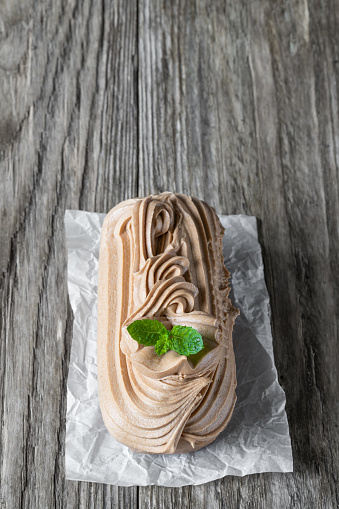 Nougat  caramel butter fudge cake on rustic wooden table