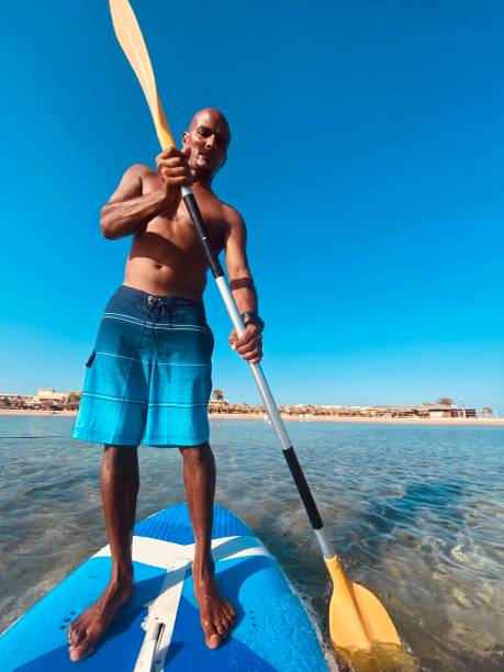 istock Young man paddling on board. 1331512071