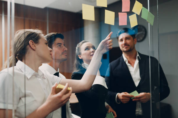 istock Business office team people molded on glass sticky note stickers 1331512082