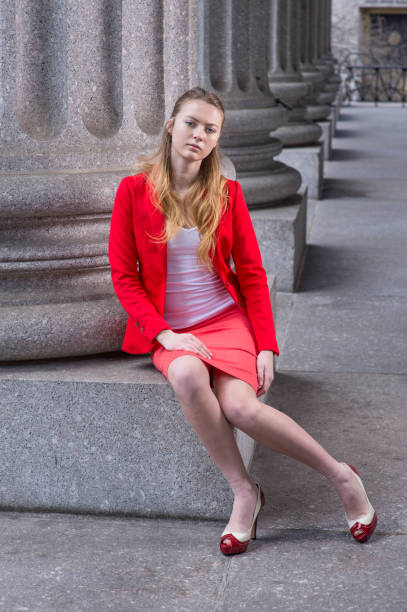 istock Young female student sitting inside office building, relaxing. 1331512922