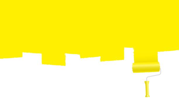 istock Paint roller paints yellow surface banner. Creative wall painting in home and office renovation. 1331514405