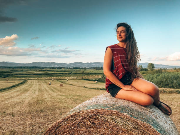 istock woman sitting on the heybales 1331517049
