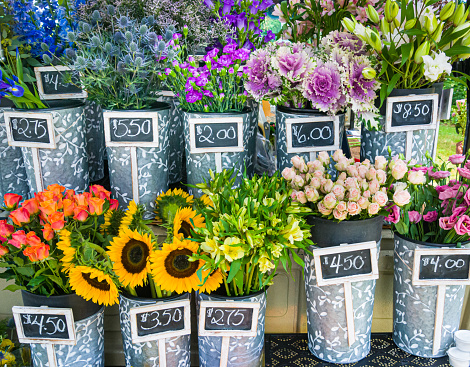Buckets of cut flowers offered for sale at a unique mobile flower shop on Cape Cod