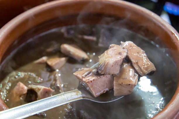 istock Ceramic pot with feijoada, typical Brazilian food. In a restaurant in Brazil 1331523971