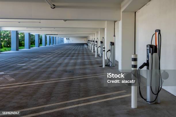 Parking Garage With Chargers Stock Photo - Download Image Now - Electric Vehicle Charging Station, Charging, Garage
