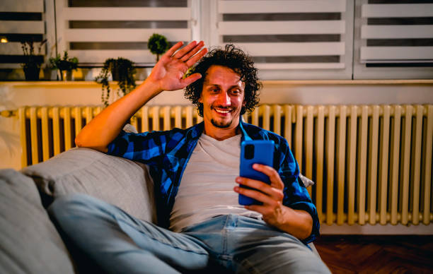 istock Man video chatting on his cell phone 1331524140