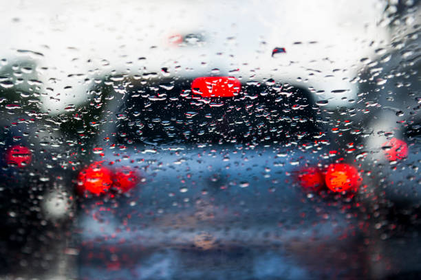 istock Bokeh, rain, water drops. Rainy day. Car flashlights defocused. 1331526708