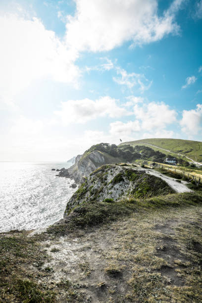 istock Sunrays Over Village And Cliffs At Durdle Door, UK 1331527394