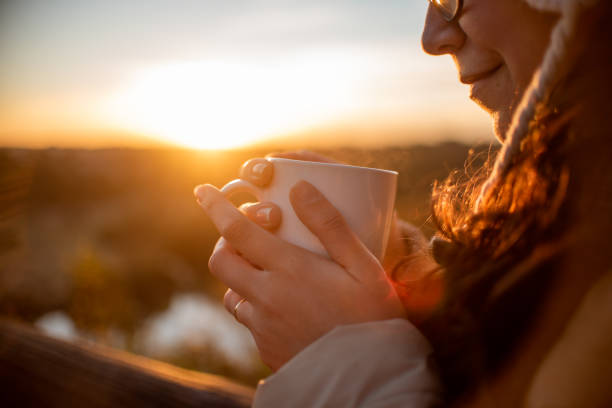 istock Woman drinking tea in late winter afternoon. 1331537055