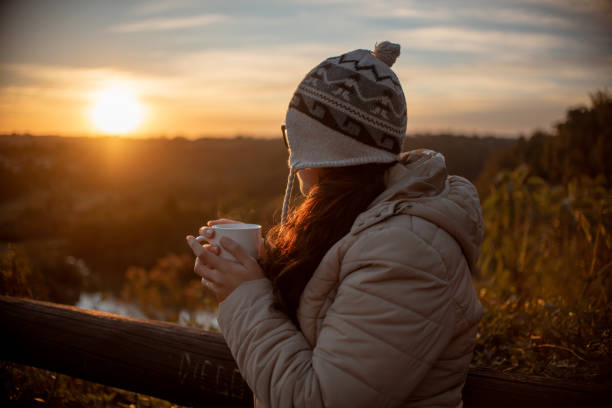 istock Woman drinking tea in late winter afternoon. 1331537064