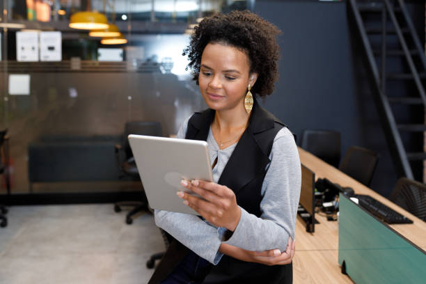 istock Businesswoman using her digital tablet 1331541131