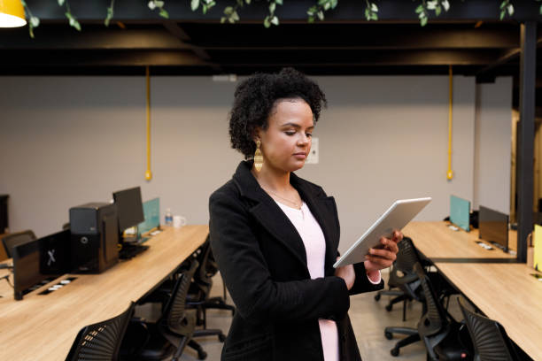 istock Businesswoman using her digital tablet 1331541158