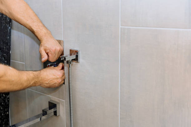 istock Installing a new on shower mixer tap in a bathroom 1331544238