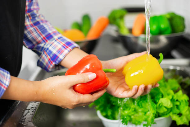 istock Washing vegetables in the kitchen sink 1331545196