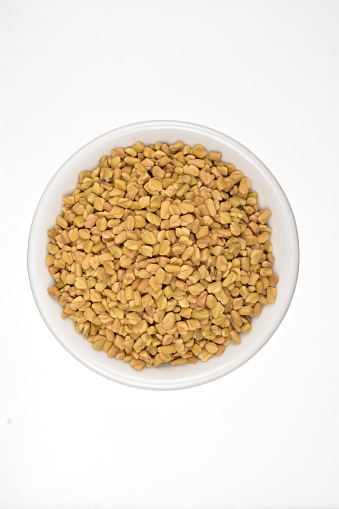 Fenugreek Seeds In Bowl Isolated On White Background With Clipping Path