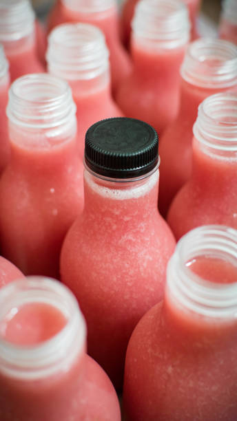 istock Isolated small plastic bottle of cold guava juice with black bottle cap 1331548151
