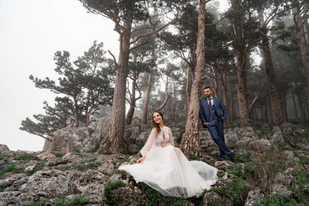 istock bride and groom in a mysterious misty mountain forest. honeymoon 1331553241