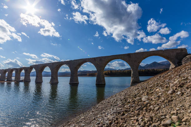istock Autumn Leaves and Taushubetsu River Bridge 1331561810