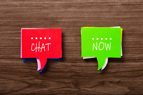 istock Bubble speech with word CHAT NOW on wooden background 1331562124