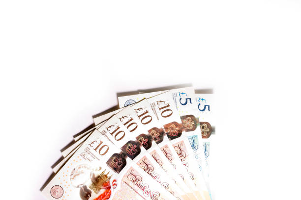 бумажный фунт стерлингов - pound symbol ten pound note british currency paper currency стоковые фото и изображения