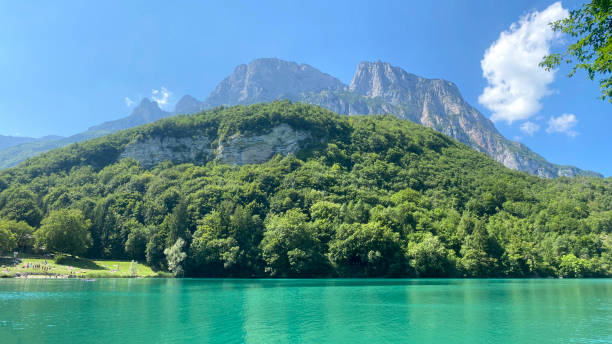 istock Small alpine lake with mountains in the background 1331571559