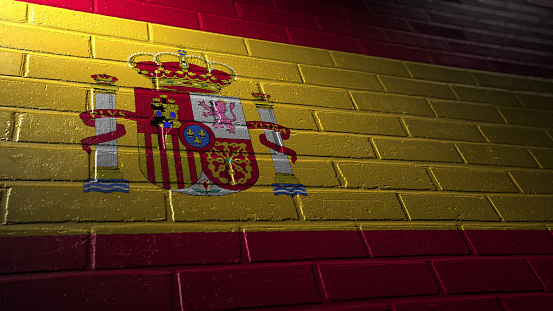 painted flag of Spain on a brick wall