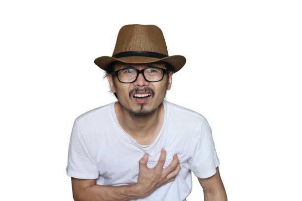 istock Asian man having a heart attack isolated on a white background. 1331597376