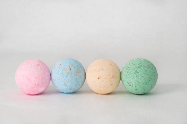 istock bathroom bombs green, pink, cream and blue on a white background 1331601645