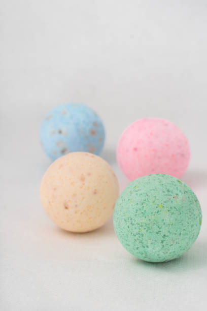 istock bathroom bombs green, pink, cream and blue on a white background 1331601664