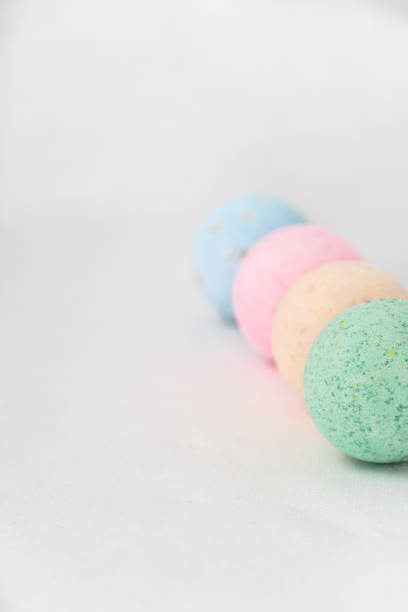 istock bathroom bombs green, pink, cream and blue on a white background 1331601705