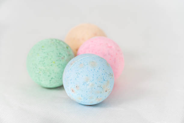 istock bathroom bombs green, pink, cream and blue on a white background 1331601729