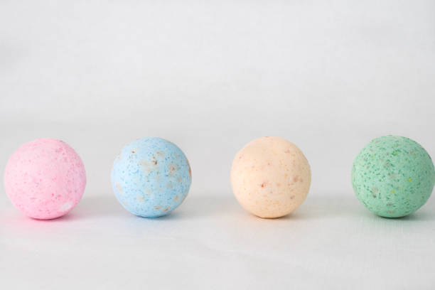 istock bathroom bombs green, pink, cream and blue on a white background 1331601739