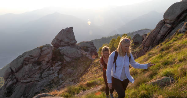 istock Two women hike back from climbing in the mountains 1331603207
