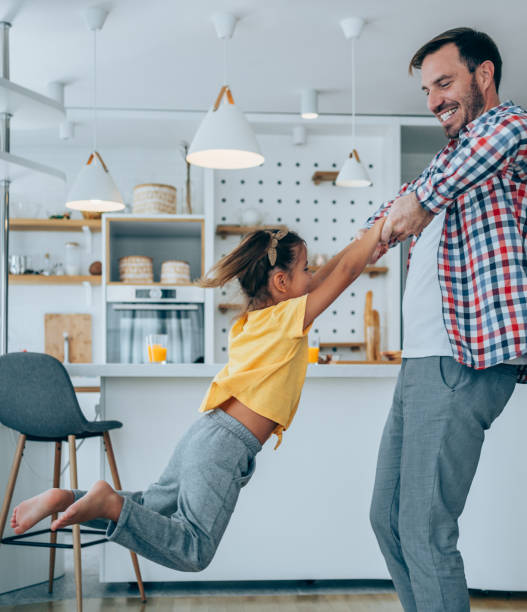 istock Happy young dad playing with his daughter. 1331603235