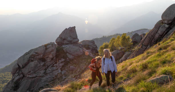 istock Two women hike back from climbing in the mountains 1331603258