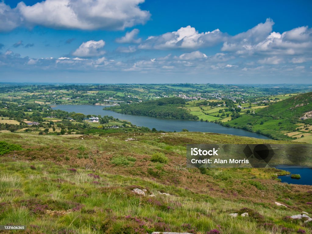 The disused reservoir of Camlough, managed by Newry and Mourne Council. Taken from a viewpoint on a route to Slieve Gullion Forest Park. A fishing spot for pike, roach, bream, perch and ferox trout. Mourne Mountains Stock Photo