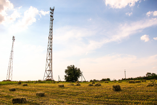 Telecom base station in Poland. Cell tower sector antennas. Mobile 5G transmitter equipment.