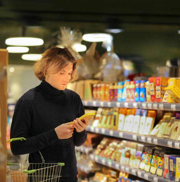 istock man choosing a dairy products at supermarket 1331610755