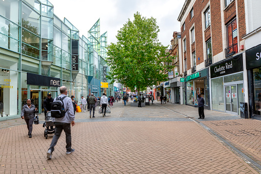 Croydon, UK - July 30, 2021: Shoppers walking on the busy pedestrianised street of North End in the middle of the city .