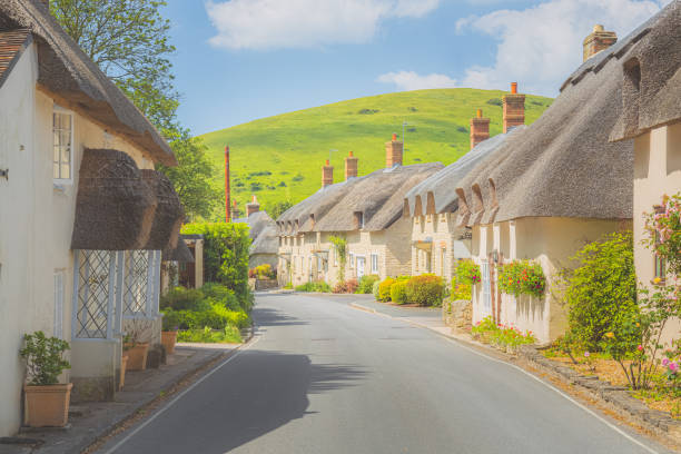 West Lulworth, Dorset Quaint, picturesque countryside thatched roof cottages in the scenic English village of West Lulworth, Dorset, England, UK. dorset england photos stock pictures, royalty-free photos & images