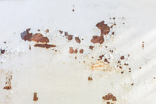 Old rusty metal sheet abstract background, rust on painted weathered steel sheet