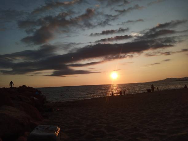istock Sunset on a family beach 1331620566